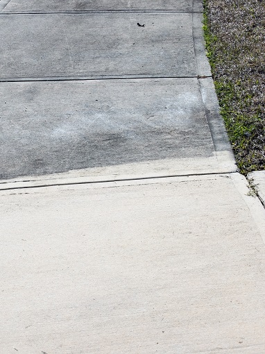 Patrially,Cleaned,And,Partial,Irty,Cement,Sidewalk,In,Front,Of